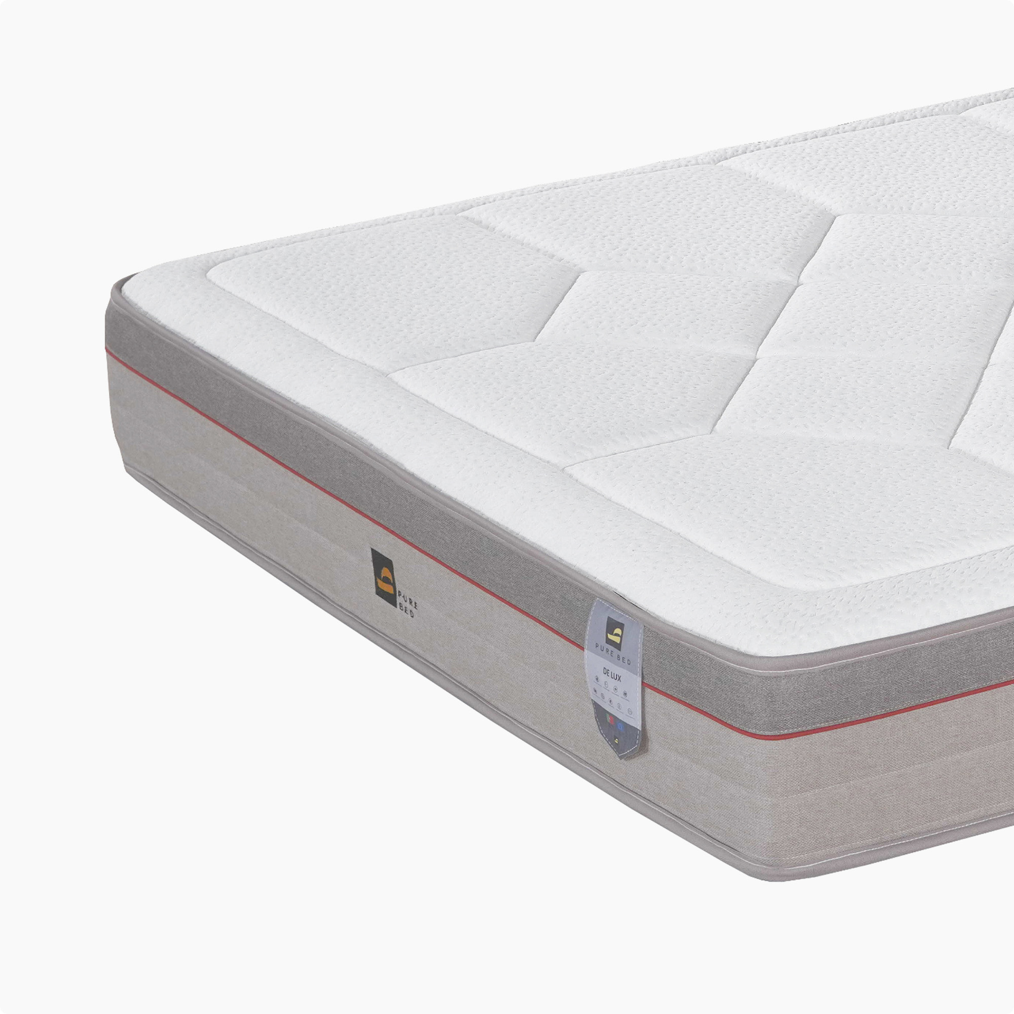 Pure Bed vzmetnica DE LUX – produktna fotografija, pogled na vogal z etiketo.